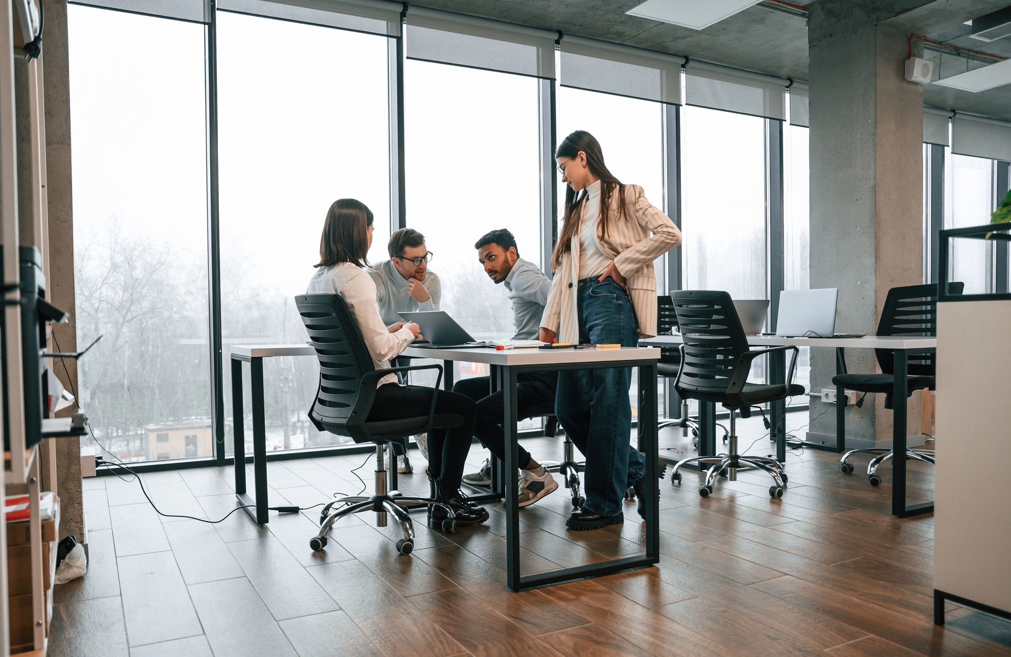 Team meeting in clean modern office - professional office cleaning service.