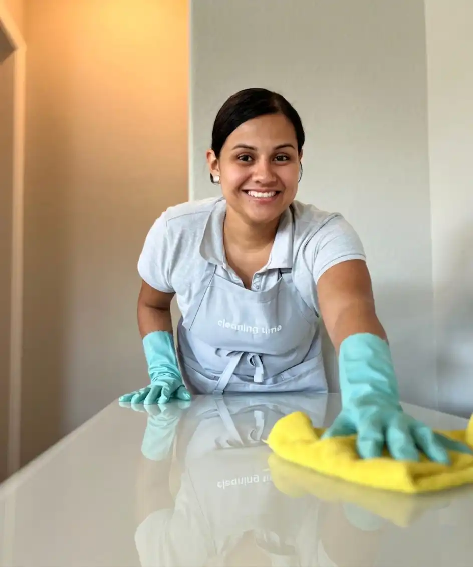 House cleaner wiping a kitchen countertop in a residential home in Austin