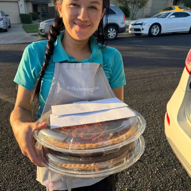 Team member holding food trays